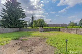 Securely fenced rear yard with freeze proof hydrants