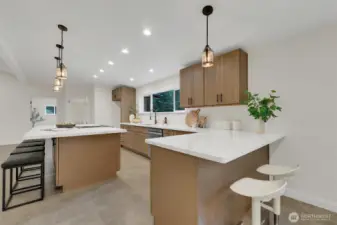 Gorgeous new countertops and cabinetry throughout the kitchen.