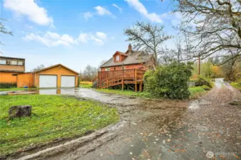 Detached two car garage, 2 separate outbuildings (and behind is a large shop)