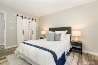Beautifully appointed owner's suite with barn doors opening to the walk-in closet.