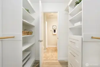 The well thought out build-ins in the walk-in closet provide ample storage  and keep everything super organized.