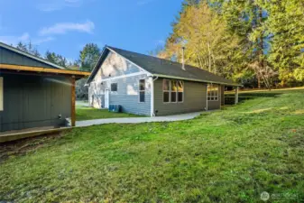 Paved pathway from backdoor to shop