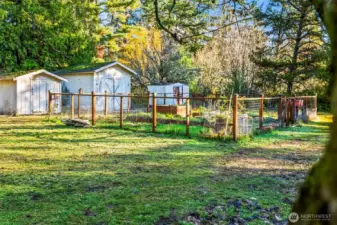 Thoughtfully designed garden fully fenced with pathways, and plenty of sunshine.
