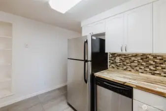 Kitchen facing hallway to bedrooms