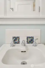 Ornate tilework is also featured above the kitchen sink.