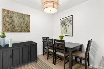 The dining area is nicely placed between the kitchen and living room.