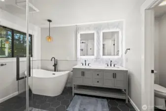 Double vanity, soaking tub, designer mirrors, heated tile floors!