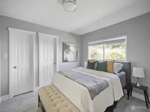 Master bedroom with walk in closet (left side) and bathroom (right side)