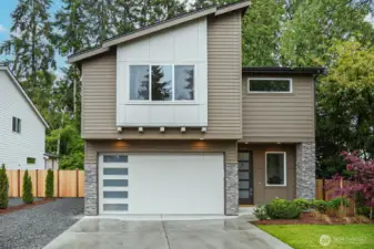 Welcome to this spectacular new  construction home that's nearing completion,  where every detail has been thoughtfully  designed for comfort, luxury, and versatility.