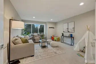Upstairs, you’ll discover an enormous family room/bonus room, offering endless possibilities. Whether you envision this space as a state-of-the-art home theater, a game room, or a cozy retreat for relaxation, this room can easily adapt to your lifestyle. The options are truly limitless.