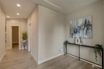 Step inside and be greeted by the bright, open floor plan that’s flooded with natural light from large, beautifully crafted windows, creating a warm and inviting atmosphere throughout.