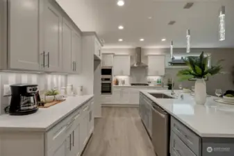 The large kitchen island serves as the perfect gathering spot for casual meals or hosting family and friends.