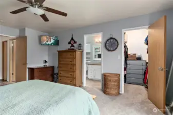 Primary bedroom with walk in closet and en suite bathroom.