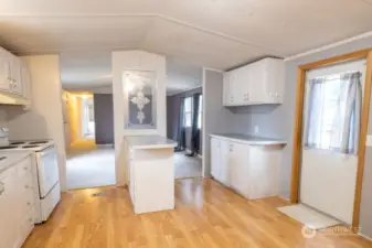 Cabinets throughout the well-planned kitchen.