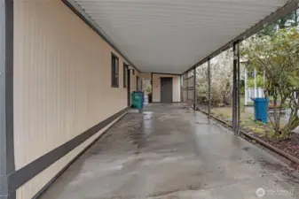 Room for two cars in the carport...