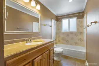 upstairs bathroom attached to primary bedroom