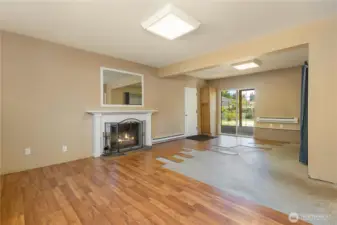 large bonus room downstairs with access to your fully fenced large back yard