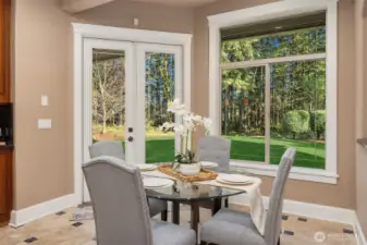 Breakfast nook with french doors that lead to all season patio for enjoyment anytime of the year.