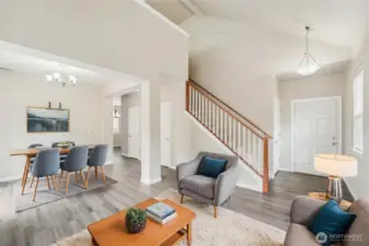 Open design living and dining room. Virtually stage.