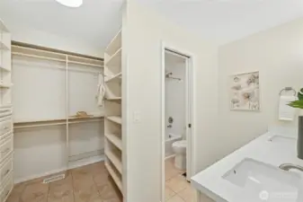 Roomy walk-in closet and Primary bath with lots of new features: quartz countertop, double sinks, mirrors, faucets, lighting and a new tub too.