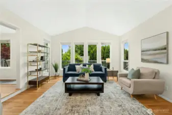 Upon entering, you will be greeted by this captivating, sun-drenched living room!