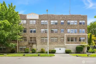 An exterior photo of the location of #111. Note that it's located up off the street even though it's on the first floor of the building.