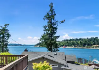 Evenings and sunsets are here to enjoy. Nestled in on this quiet street so close to freeways, shopping, schools, medical facilities and Gig Harbor. Views are never a tease on a nice day with beach access and a public boat launch just a few doors away. Launch your water toys and let summer begin.