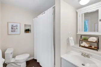 Second full Bath off the Kitchen area on the upper level is great for guest use and off the back entry.