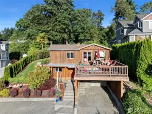 Carport under deck and 2 cars can park in front.