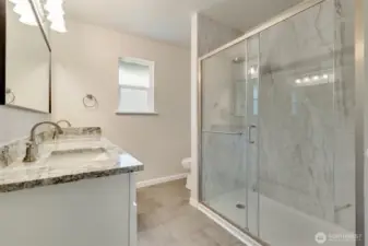 Upstairs Primary Bathroom with custom shower, double sinks and granite counters too