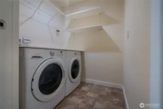 Separate laundry room with full washer and dryer.