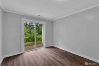 Bedroom 4 has slider leading to backyard.