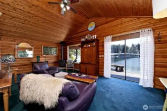 Living area with doors to the deck and beach.