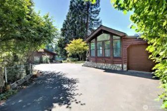 Gated entry to paved driveway.