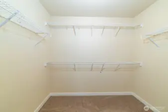 Spacious walk-in closet connected to the main primary ensuite bath