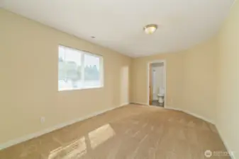 An additional primary bedroom with en-suite bath is located on the second floor