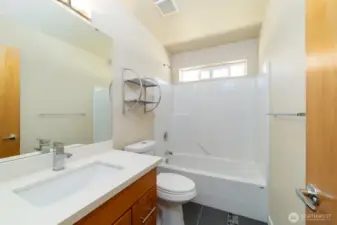 Third full bathroom located in the upstairs hallway