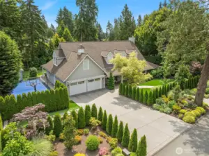 This idyllic home is "Father of The Bride" perfect, complete with the white picket fence, specimen gardens, sport court, putting green and covered patio!