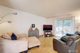 Main level living room looks out over rear yard