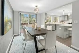 Spacious dining room right off the kitchen and opens up to expansive deck.
