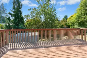 Large deck just off the kitchen and dining area — ideal for hosting friends and weekend BBQs.