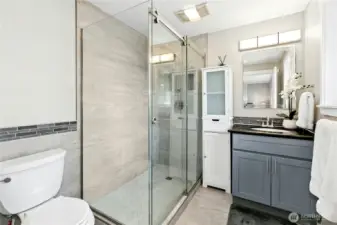 This beautifully updated primary bathroom features modern upgrades and tasteful design choices, creating a relaxing and luxurious ensuite experience.