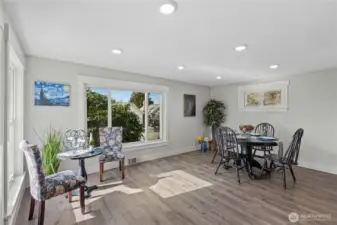 Living and Dining Rooms showing how spacious this area is. Notice the Fully Millwork Wrapped windows and recessed lighting.