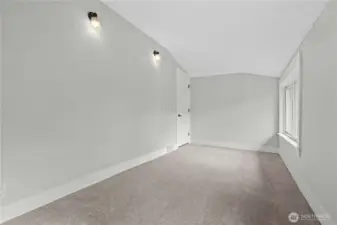 Bedroom #2 w/view of the opposite wall with sconces for unique lighting feature.