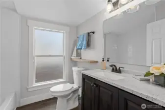 Full Bath for guests and other bedrooms to enjoy. Laminate Floors, New Vanity and Fixtures!
