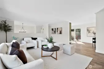 Open flow from living room room to dining, kitchen and deck areas.