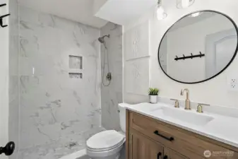 Updated 3/4 bathroom with tile shower, located downstairs.