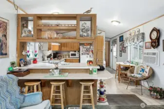 Nice breakfast bar to eat at that opens to both kitchen & family room.