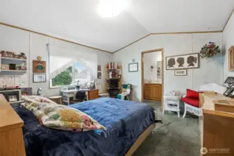 Vaulted ceilings, large window, several pieces of furniture & still this room feel spacious!