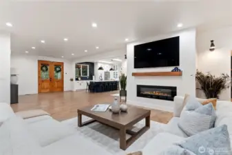 View of family room into entry way and kitchen